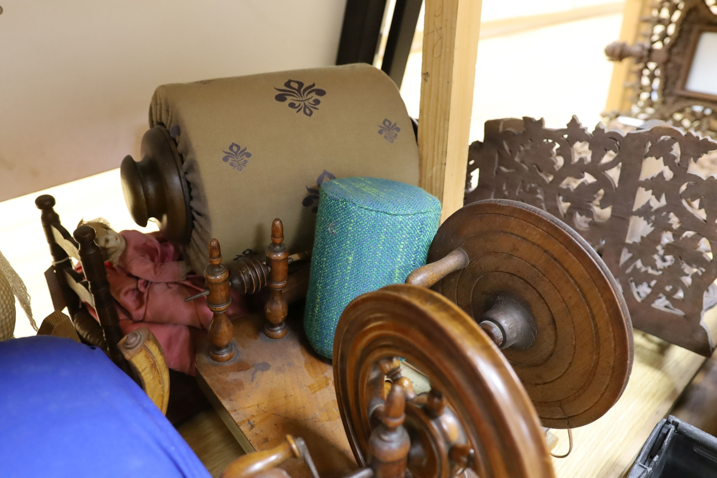 Two model spinning wheels, lace-maker’s pillows, bobbins, pillows etc